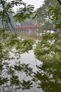 The famous red bridge in Hanoi at Hoan Kiem Lake. Vietnam. clipart