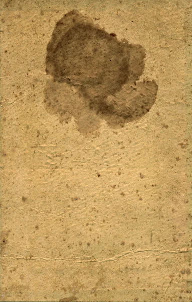 Старая текстурная бумага с рваной кромкой и пятном — стоковое фото