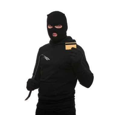 Thief in mask with crowbar and credit card on white background