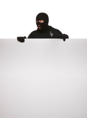 Thief in mask with crowbar on white background, free space.