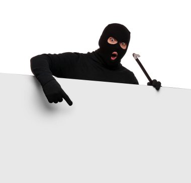Thief in mask with crowbar on white background, free space.