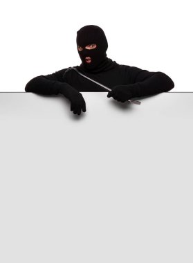 Thief in mask with crowbar on white background, free space.
