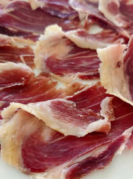 Spanihs jamon iberico cut in a plate
