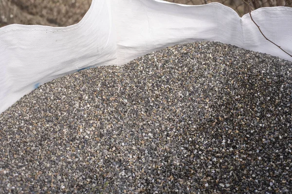 Close Small Gravel Transported White Woven Sack — Stock Photo, Image
