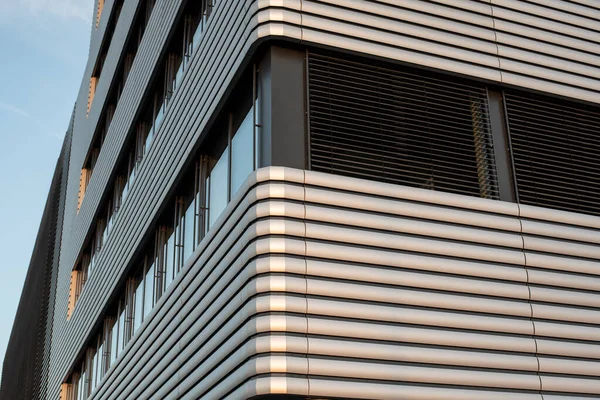 close-up of the edge of a facade of a business building with a metal facade