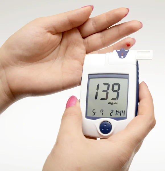 Measuring blood sugar — Stock Photo, Image