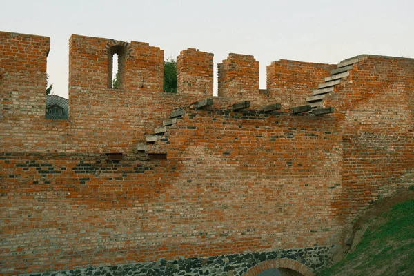 Walls and tower of an ancient castle. Brick walls and watchtower of an ancient castle. History - ancient Ukrainian castle