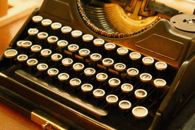 Old vintage typewriter - closeup. Ancient classic black typewriter - close up shot