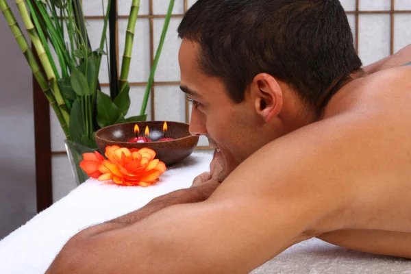 Young man receiving massage — Stock Photo, Image