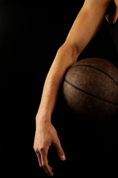 Basketballspieler mit Ball Stockfoto