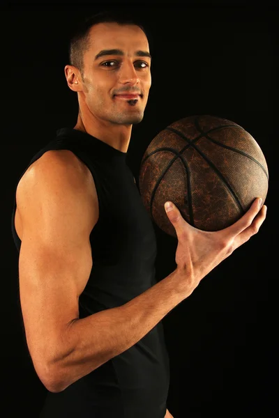 Jogador de basquete segurando bola Imagens De Bancos De Imagens