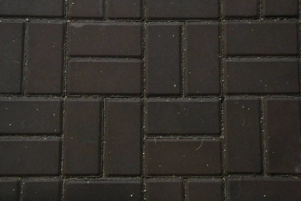 Açık fayans, sokak fayanslarının koyu gri dokusu 