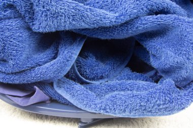 Dirty clothes in laundry basket before washing