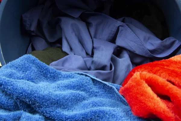 Dirty clothes in laundry basket before washing