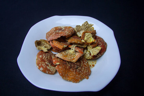 Dried caps of red fly agaric. Treatment with fly agarics