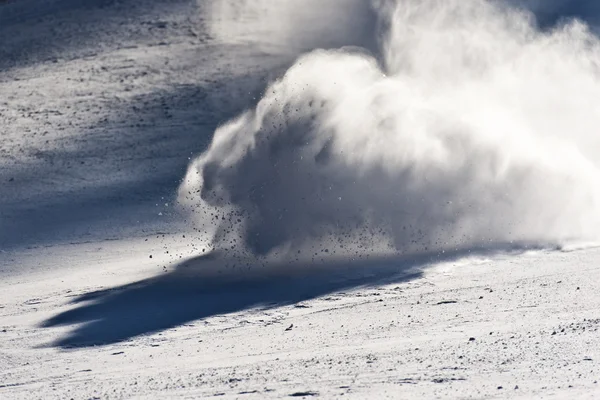 Young ski racer during a slalom competition falling down Stock Picture