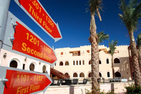 Red signs in a tropical hotel, Morocco, — Stock Photo, Image