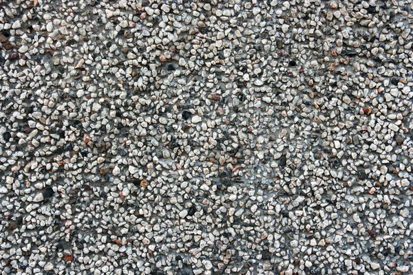 Asfalt närbild. bakgrunden med mycket små stenar på nära håll — Stockfoto