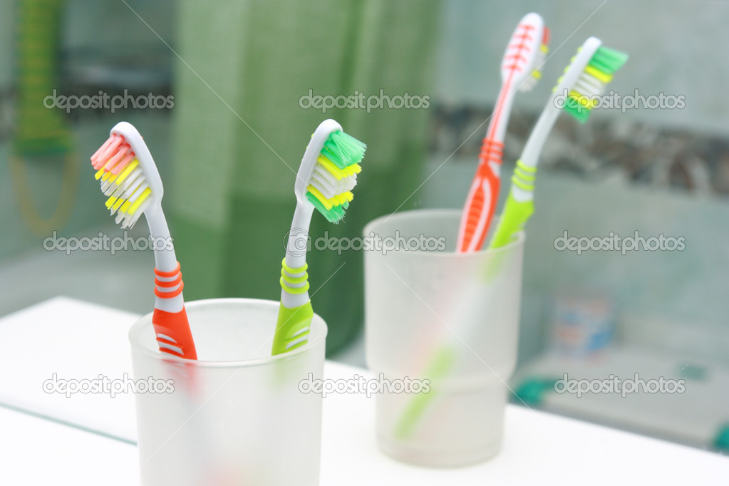 Two Toothbrushes in a bathroom. Close up shot of toothbrush.