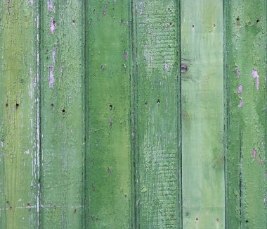 soyulması boya ile eski bir çit. yeşil boyalı ahşap adam eski