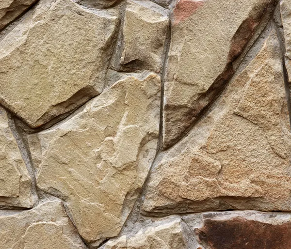 Stones mosaic.The wall from different, stones, small and big. — Stock Photo, Image