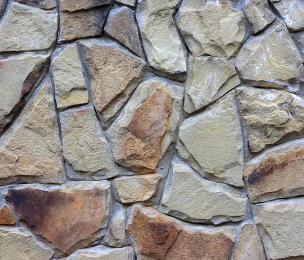 Mosaic.the muur van verschillende, stenen, kleine en grote stenen. — Stockfoto