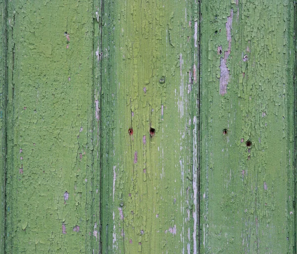 Old fence with peeling paint. Green old painted wooden backgroun — Stock Photo, Image