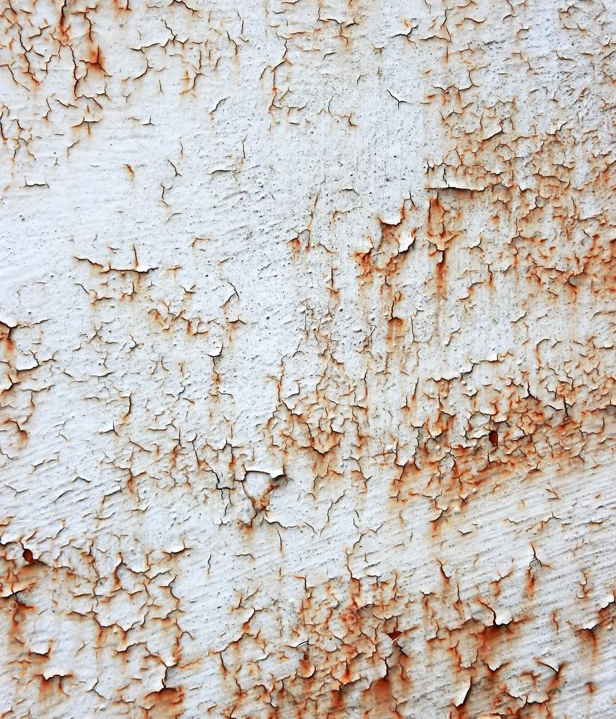 A rusty old metal plate with cracked white gloss paint.abrasion,