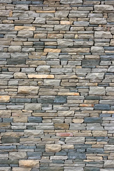 Grijze bakstenen muur als achtergrond. — Stockfoto