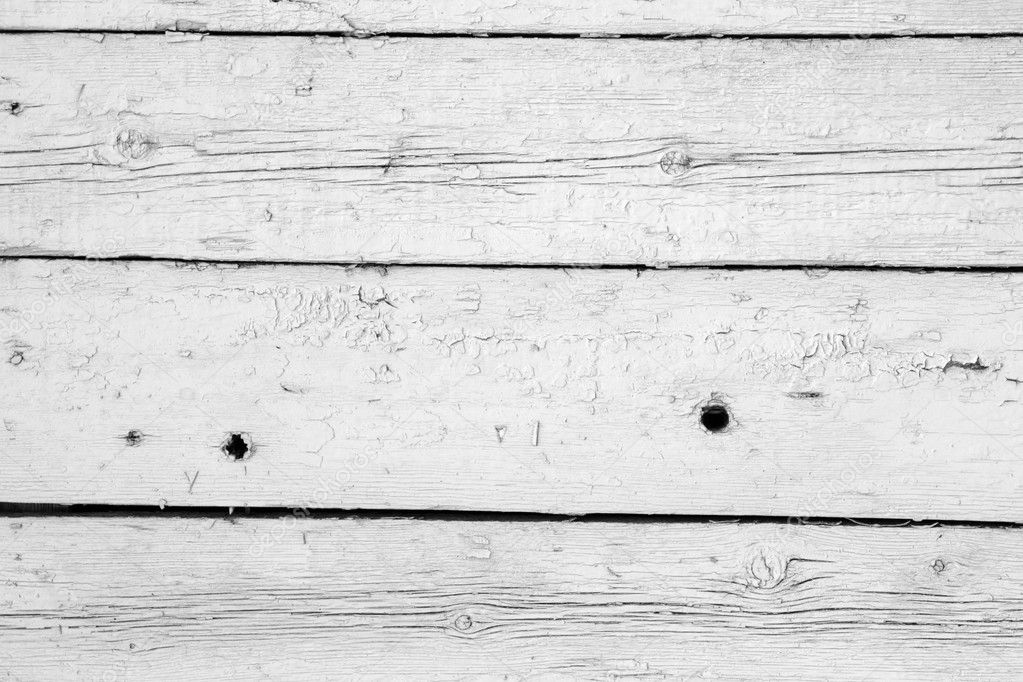 White wooden planks in rusric fence.