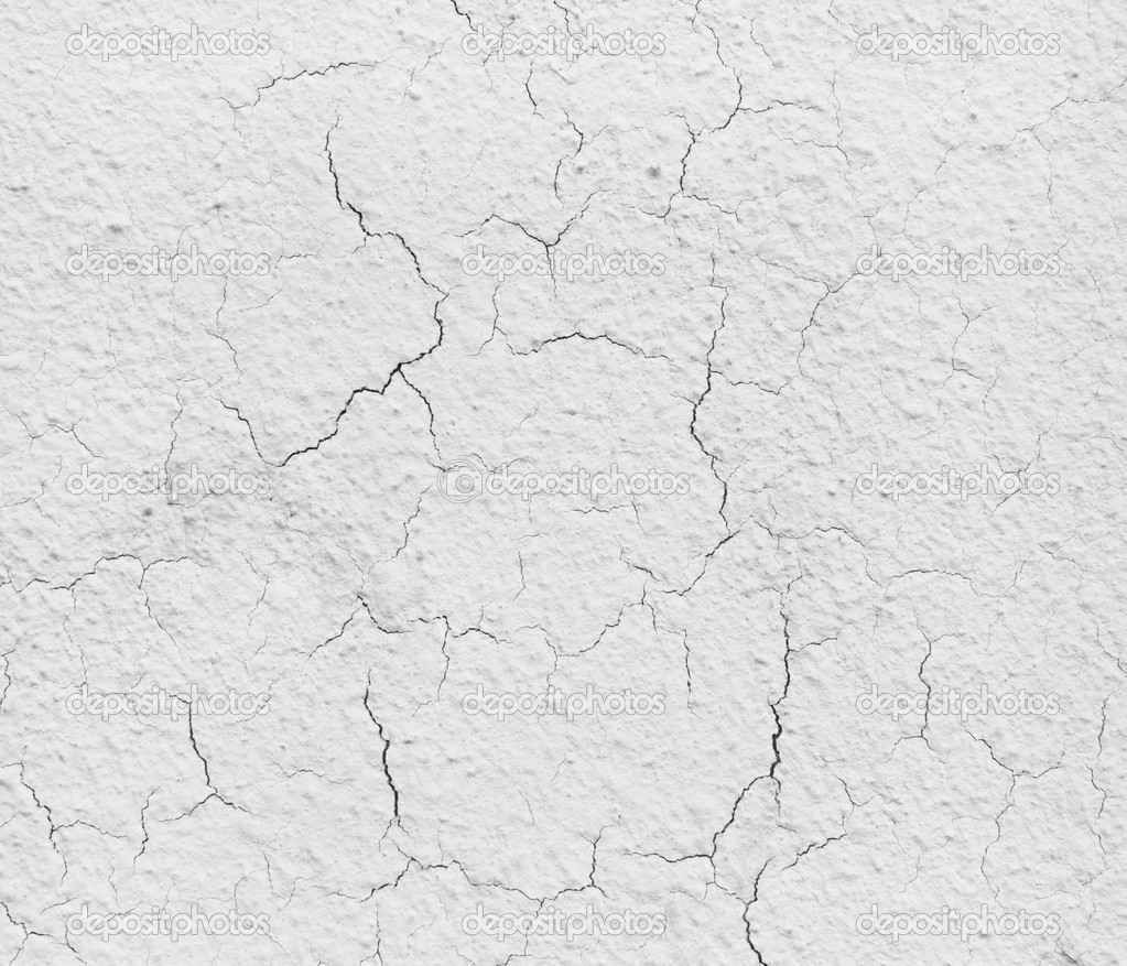 Texture of a grey cement wall with cracks. Grey concrete wall.