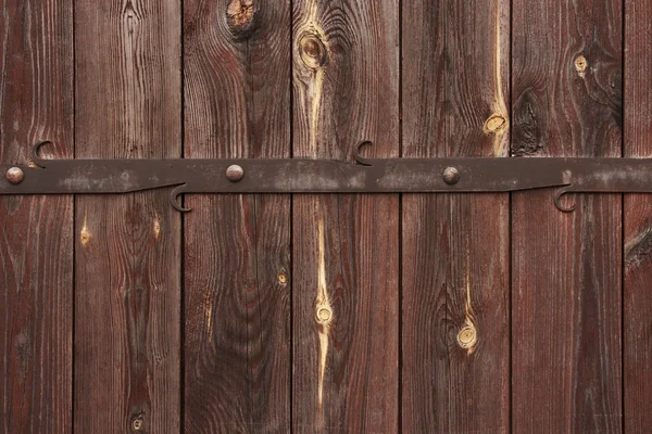 Wooden gate with forged metal decorations. Royalty Free Stock Photos