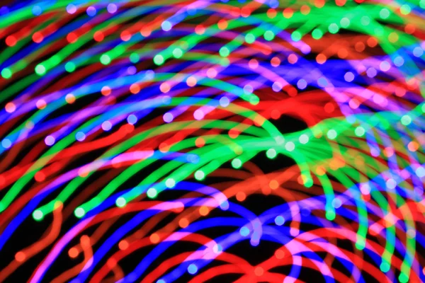 Abstract light background. Сolored lights, salute, radial beams — Stock Photo, Image