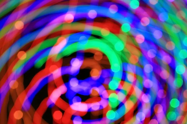 Abstract light background. Сolored lights, salute, radial beams — Stock Photo, Image