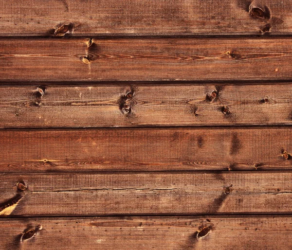 Holzuntergrund. einfache Holzbohlen mit Zweigen. — Stockfoto