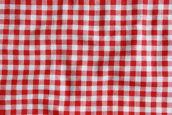 Konsistens av en röd och vit rutig picknick filt. — Stockfoto