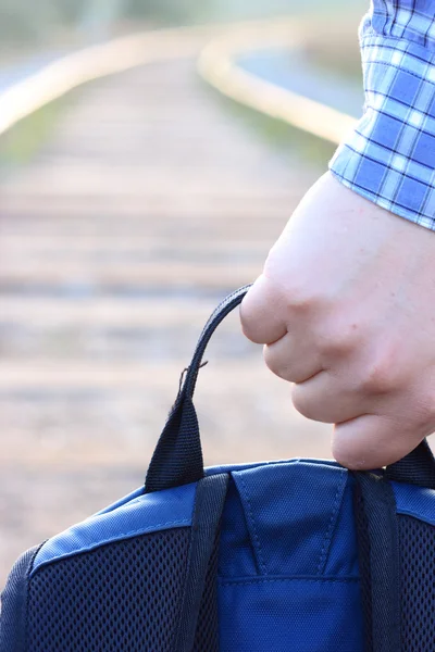 Backpack in a hand — Stock Photo, Image