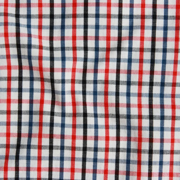 Texture di una coperta da picnic a quadretti rossi e bianchi . — Foto Stock