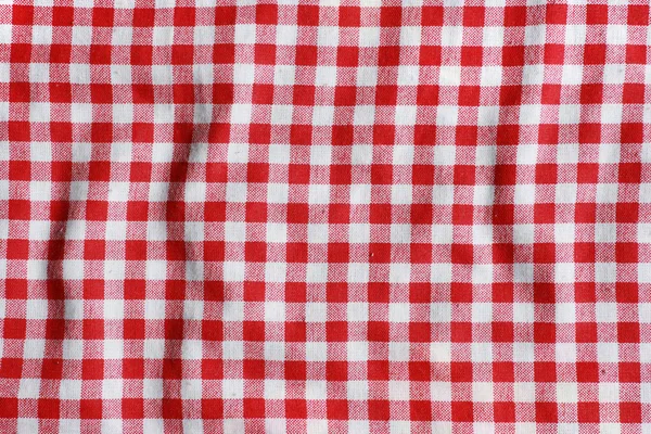 Doku, kırmızı ve beyaz kareli Piknik battaniyesi. — Stok fotoğraf