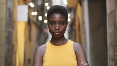 Young woman smiling at the camera while moving in towards to her.