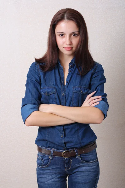 Pretty girl in jeans indoors — Stock Photo, Image