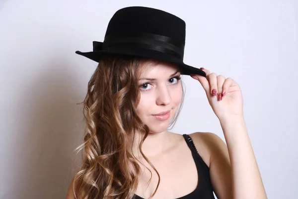 Beautiful young model in hat white background — Stock Photo, Image