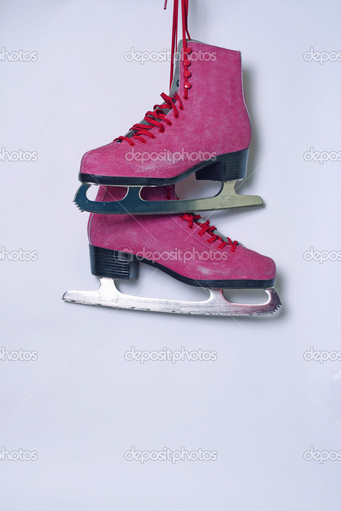 Pair of pink women's ice skates on white background — Stock Photo © visoook  #37691457
