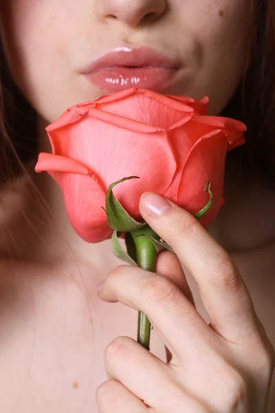 Close up beauty portrait of a girl with coral orange rose — Stock Photo, Image