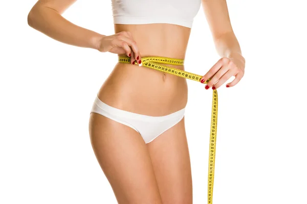 Measures the waist — Stock Photo, Image