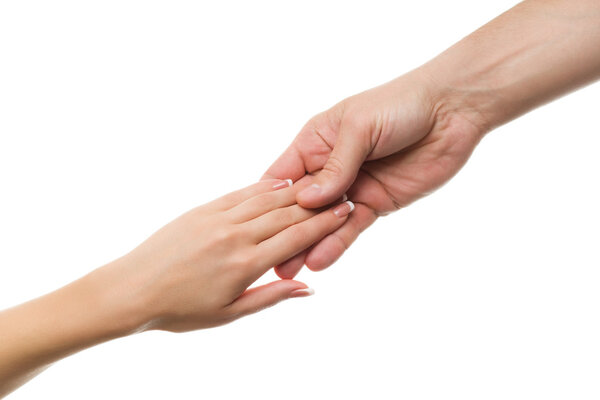 The hand of the man and the woman's hand a gentle touch