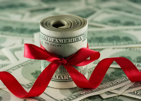 Dollars with a red bow — Stock Photo, Image