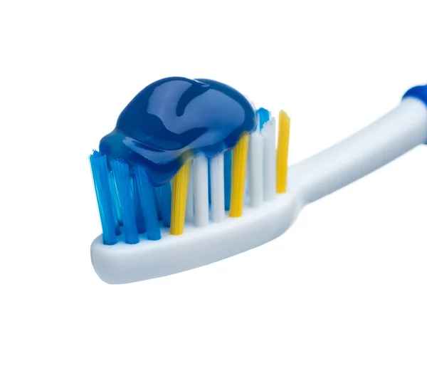 Pasta de dientes en cepillo de dientes azul —  Fotos de Stock