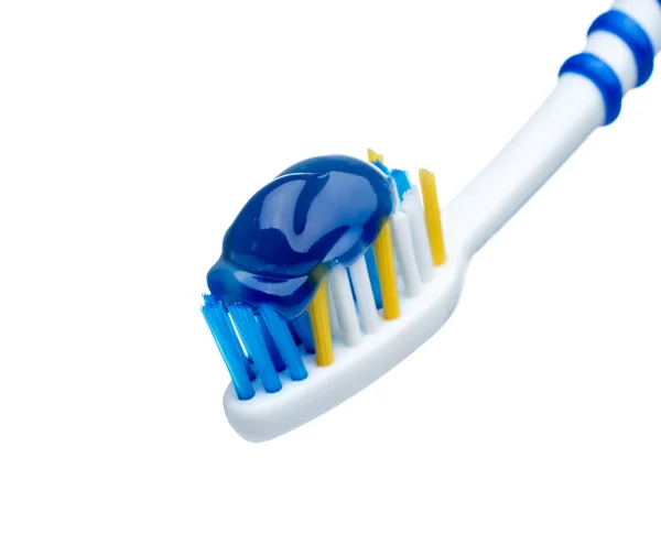 Pasta de dientes en cepillo de dientes azul — Foto de Stock