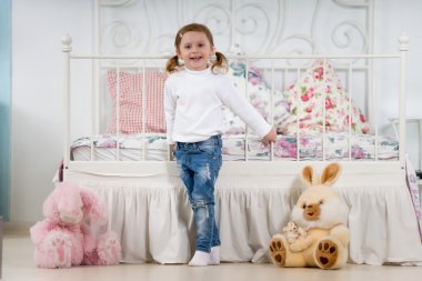 Little girl in the bedroom